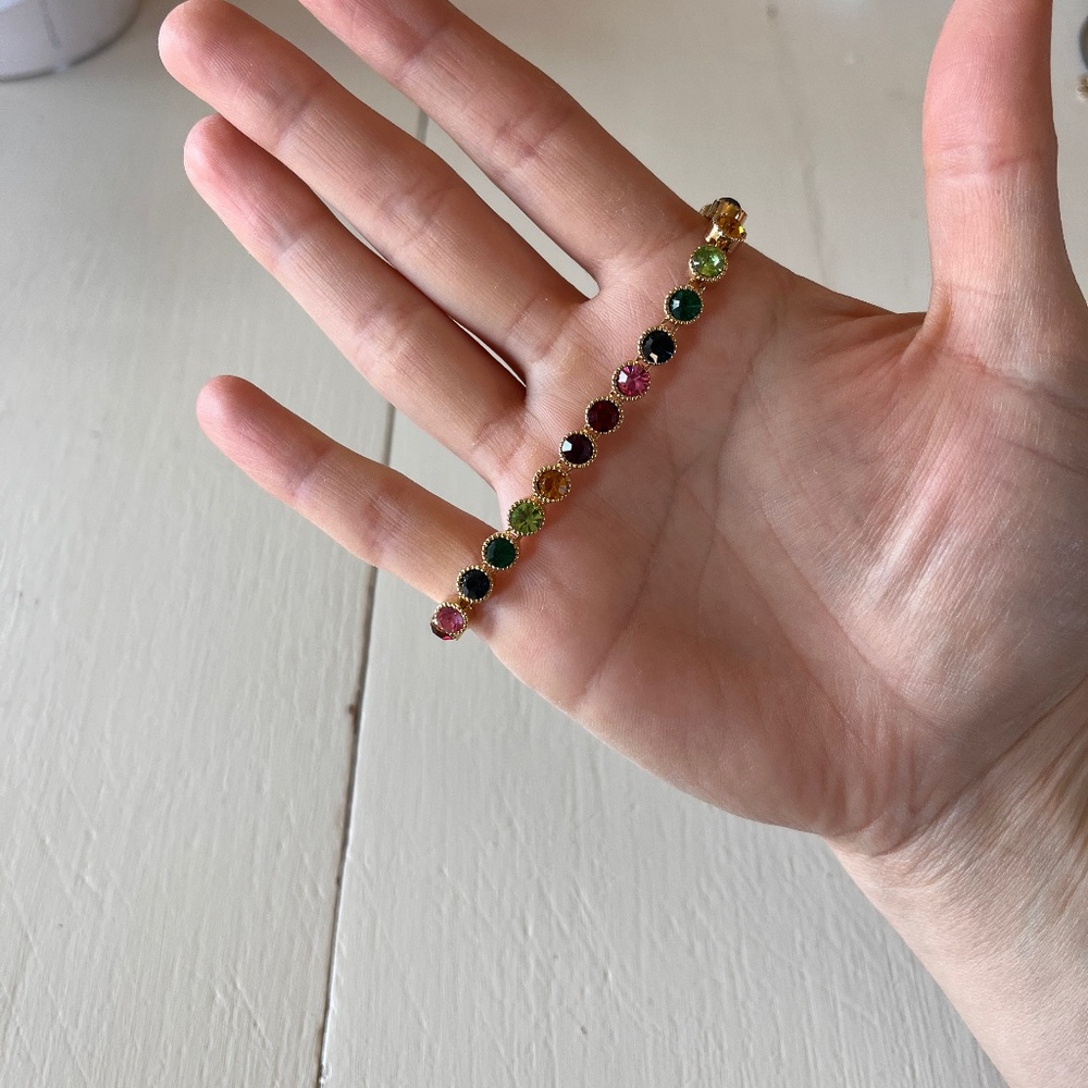 Gold bracelet with rainbow stones